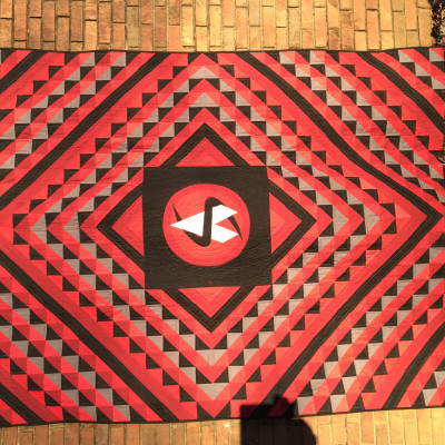 Synced Up.  Designed a quilt using my grandsons personal logo.