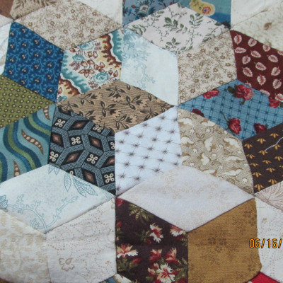 hand piecing scrappy stars with reproduction fabric scraps ...cut by hand, piece