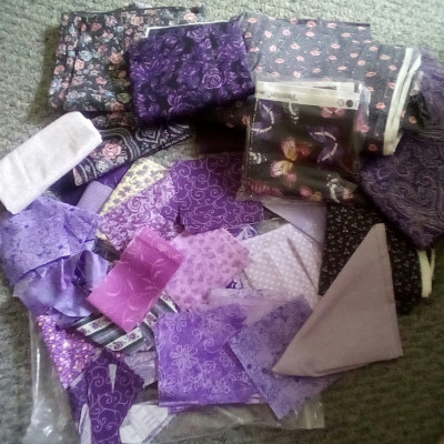 Purple prints with white on white background.  I hope to do picnic or queen size