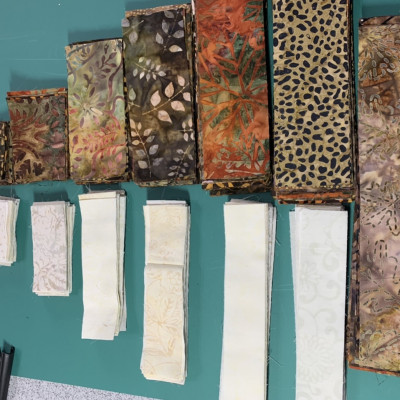 All the pieces are cut for a circle log cabin.I used fat quarters and scraps. No