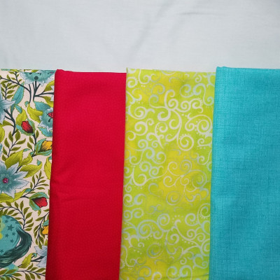 My fabric choices - top is background, lower left will be the border, then left
